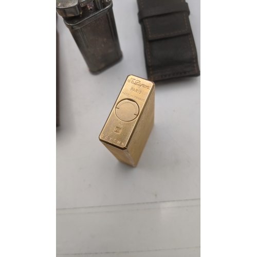 27 - Two cigarette lighters to include a silver plated vintage Dunhill Unique in a branded leather case a... 