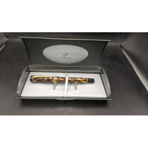3 - A boxed Parker Duofold continental fountain pen with an amber mosaic design and an 18ct gold nib
Loc... 