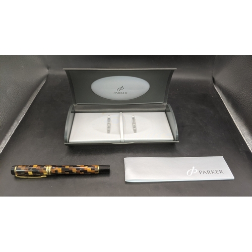 3 - A boxed Parker Duofold continental fountain pen with an amber mosaic design and an 18ct gold nib
Loc... 