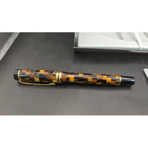 3 - A boxed Parker Duofold continental fountain pen with an amber mosaic design and an 18ct gold nib
Loc... 