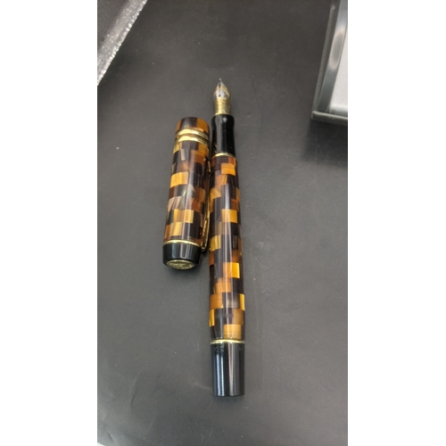 3 - A boxed Parker Duofold continental fountain pen with an amber mosaic design and an 18ct gold nib
Loc... 