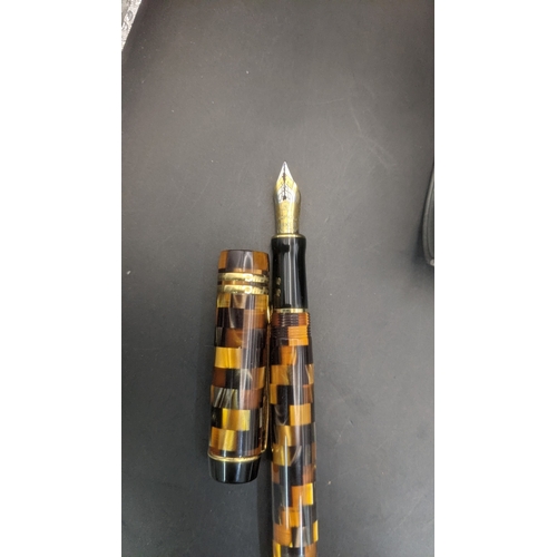 3 - A boxed Parker Duofold continental fountain pen with an amber mosaic design and an 18ct gold nib
Loc... 