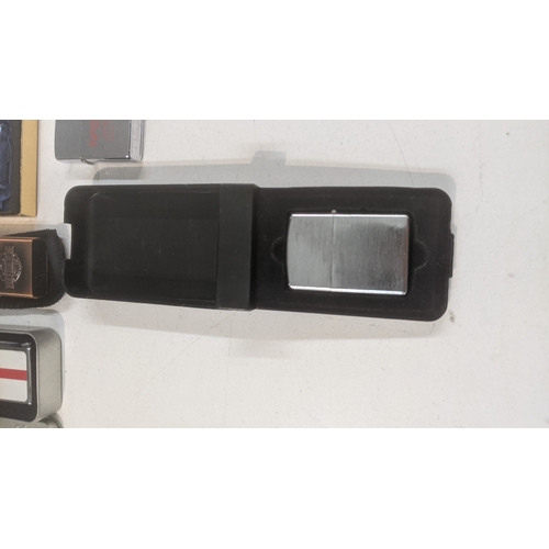 31 - A group of 10 cigarette lighters to include a boxed Piezo electric gold plated example, a boxed King... 