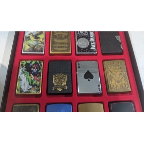 33 - A collection of 20 themed Zippo and Zippo style lighters to include two Jack Daniel's examples, four... 