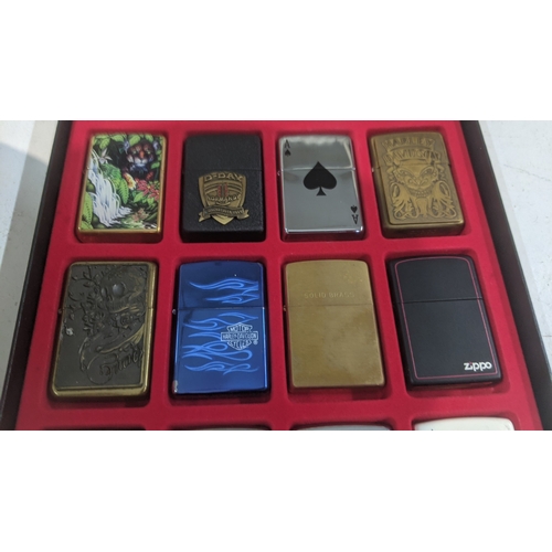 33 - A collection of 20 themed Zippo and Zippo style lighters to include two Jack Daniel's examples, four... 