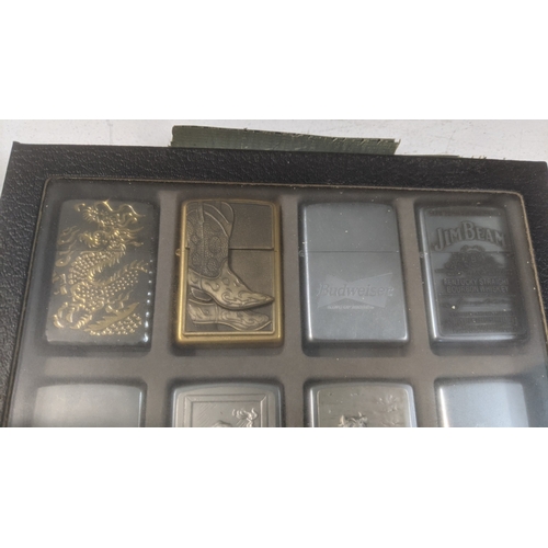 34 - A collection of 20 themed Zippo and Zippo style lighters to include a Budweiser example, a Marshall ... 