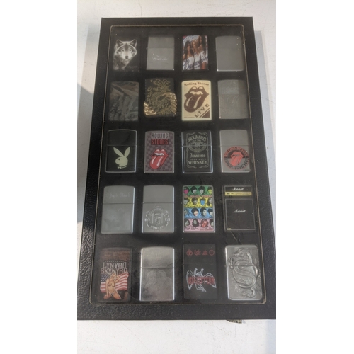 35 - A collection of 20 themed Zippo and Zippo style lighters to include a Rollin Stones Some Girls examp... 