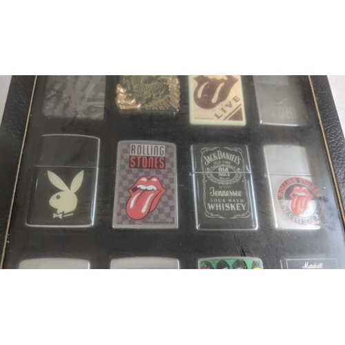 35 - A collection of 20 themed Zippo and Zippo style lighters to include a Rollin Stones Some Girls examp... 