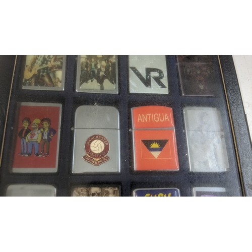 36 - A collection of 20 Zippo style lighters to include various Guns n Roses examples, a Star Wars exampl... 