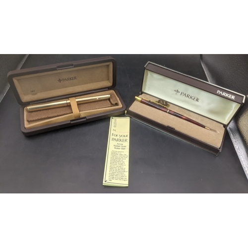 5 - Boxed Parker writing equipment to include a Sonnet 75 ballpoint pen with a brown lacquered finish an... 