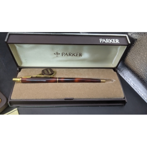 5 - Boxed Parker writing equipment to include a Sonnet 75 ballpoint pen with a brown lacquered finish an... 
