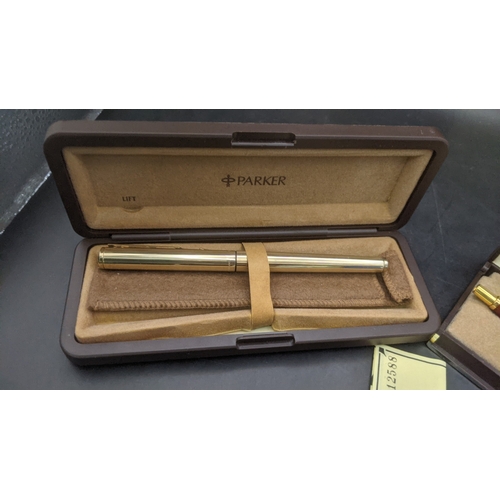 5 - Boxed Parker writing equipment to include a Sonnet 75 ballpoint pen with a brown lacquered finish an... 