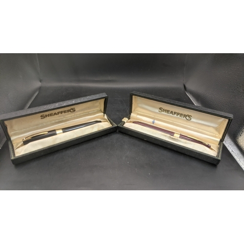 6 - Two boxed vintage Sheaffer fountain pens to include a burgundy cased example with a 14ct gold nib an... 