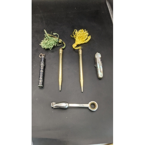 9 - Desktop collectables to include a mother of pearl handled pen knife, a pair of rolled gold cased pro... 