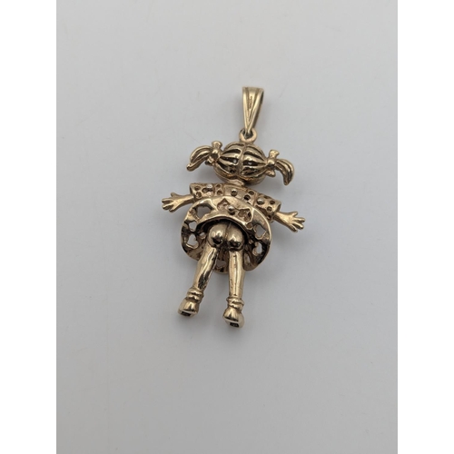 1 - A 9ct yellow gold Angelica Pickles rugrats doll pendant set with coloured stones having articulated ... 
