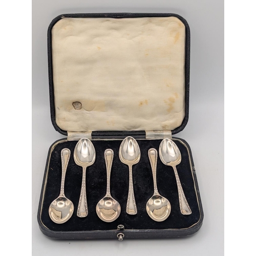 13 - A set of six silver teaspoons by H Stroud Ltd with beaded decoration to the terminals hallmarked She... 