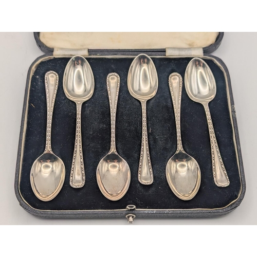 13 - A set of six silver teaspoons by H Stroud Ltd with beaded decoration to the terminals hallmarked She... 