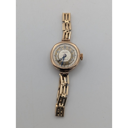 16 - A 9ct gold ladies Lenroc wristwatch on a rolled gold bracelet, total weight 12.5g Location:C1
If the... 