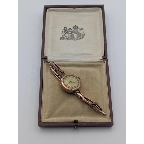 19 - An early 20th century ladies 9ct rose gold cased wristwatch on a 9ct gold expanding bracelet with la... 