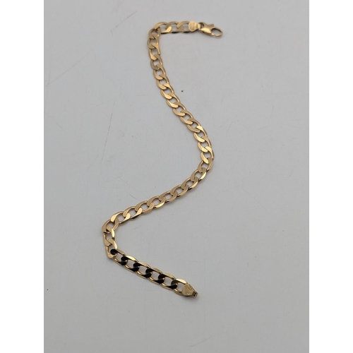 20 - A 9ct yellow gold curb link bracelet with lobster claw clasp stamped 375, 22cm long, 8.9g Location:C... 