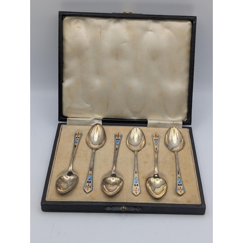 22 - A set of six George VI silver and enamel coffee spoons by Baker Brothers Silver Ltd housed in a fitt... 