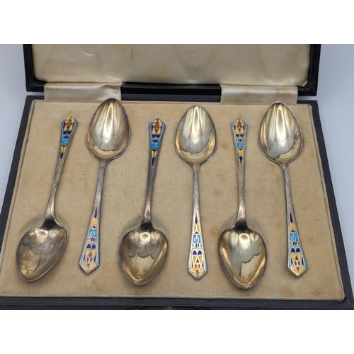 22 - A set of six George VI silver and enamel coffee spoons by Baker Brothers Silver Ltd housed in a fitt... 