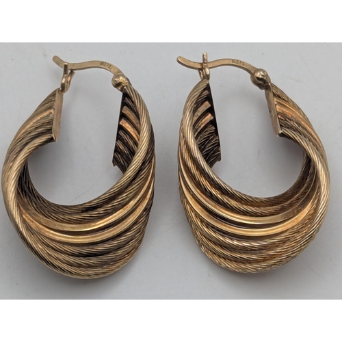 29 - A pair of 9ct yellow gold multi-layered hoop earrings with textured design, weight 5.2g
Location:C1
... 