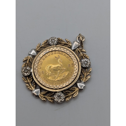 3 - A South African Krugerrand gold coin mounted in a 9ct yellow and white gold diamond set pendant with... 