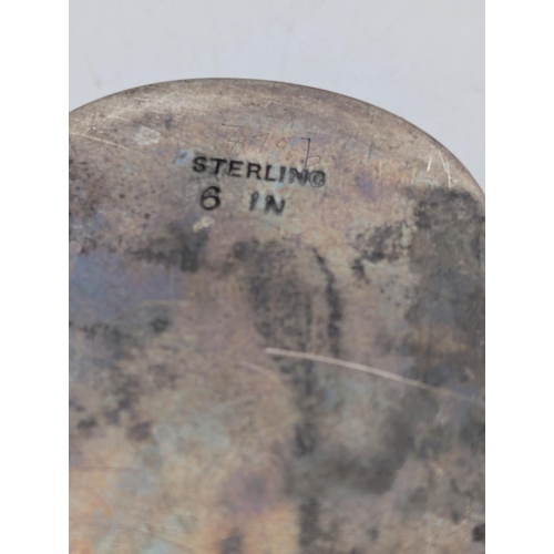 34 - A sterling silver tobacco box in oblong form, floral scroll engraved decoration with initials to the... 