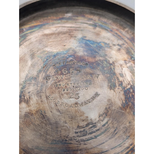 35 - A sterling silver tankard by Tiffany and Co having engine turned decoration with central multi-layer... 