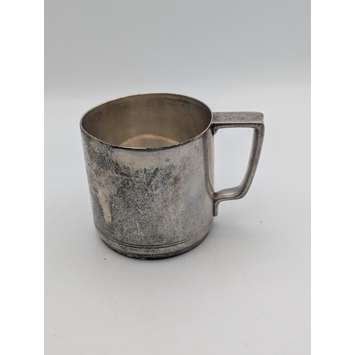 36 - A sterling silver tankard by Tiffany and Co with engraved double line to the base and engraved initi... 