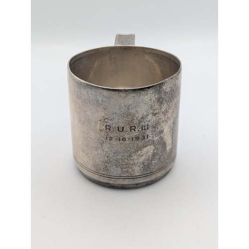 36 - A sterling silver tankard by Tiffany and Co with engraved double line to the base and engraved initi... 