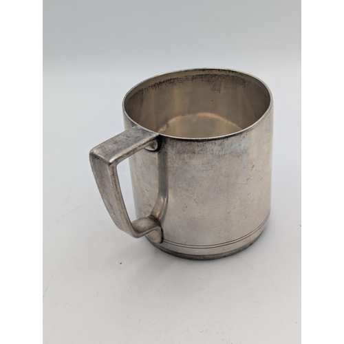 36 - A sterling silver tankard by Tiffany and Co with engraved double line to the base and engraved initi... 