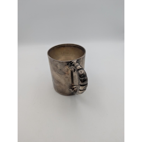 37 - A sterling silver lidded pot by Tiffany and Co having an ornate handle and engraved initials and dat... 