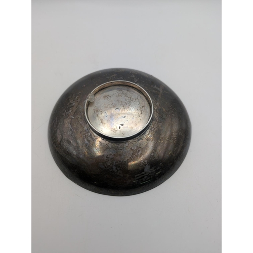 39 - A sterling silver dish in circular form and flared rim, 13cm diameter, weight 102.7g
Location:P7
If ... 