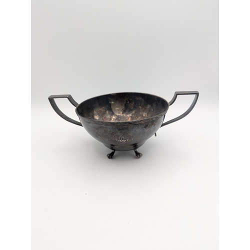 40 - A silver cup by Hardy and Hayes and Co with twin handles and engraved cartouche to the centre with i... 