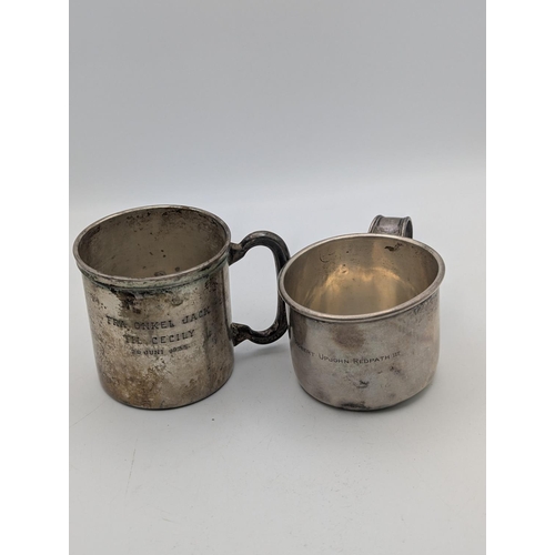 41 - A sterling silver small cup 73.5g together with an 830 grade silver tankard 77.1g, both with engrave... 