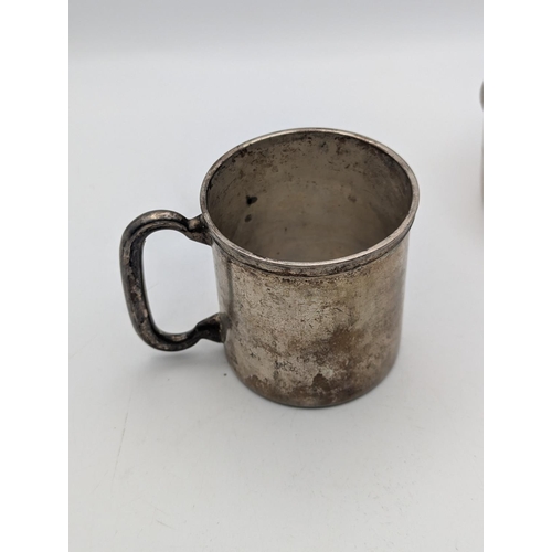 41 - A sterling silver small cup 73.5g together with an 830 grade silver tankard 77.1g, both with engrave... 