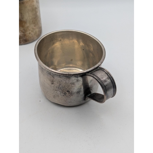 41 - A sterling silver small cup 73.5g together with an 830 grade silver tankard 77.1g, both with engrave... 