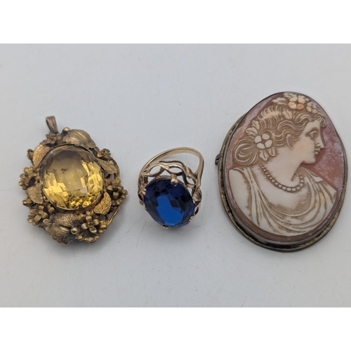 44 - A 9ct gold ring set with a large blue paste stone, early 20th century cameo brooch set with gilt whi... 