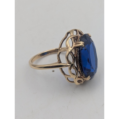 44 - A 9ct gold ring set with a large blue paste stone, early 20th century cameo brooch set with gilt whi... 