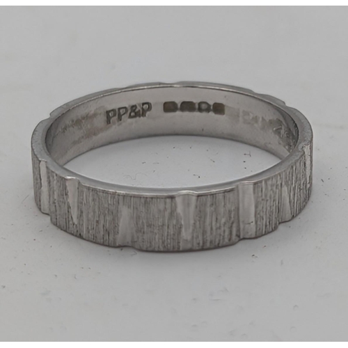 45 - An 18ct white gold wedding band with textured design, size L, weight 3g
Location:R1
If there is no c... 