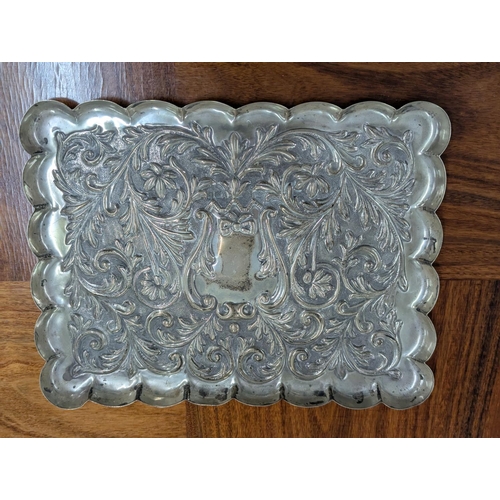53 - A Mappin and Webb silver dressing table tray having embossed scroll, acanthus leaves decoration with... 