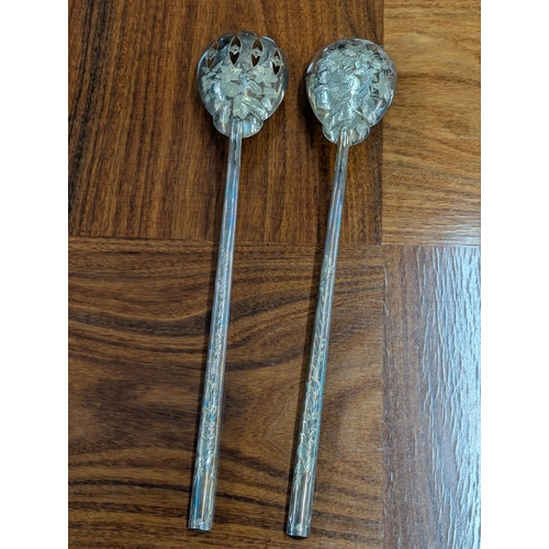 54 - A pair of Victorian salad servers with floral engraved decoration to the base of the bowls and termi... 