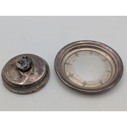 56 - A silver pin dish with stepped rim and repeating engraved decoration 43.4g together with a silver fi... 