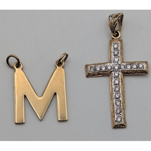 8 - Two 9ct yellow gold pendants to include a cross pendant set with cubic zirconias along with 'M' init... 