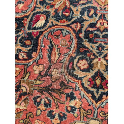 An antique Persian Kashan rug, all over floral design with central ...