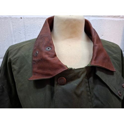3 - Mulberry- A gents green wax cotton drovers coat having a brown leather collar and elbow pads and tar... 