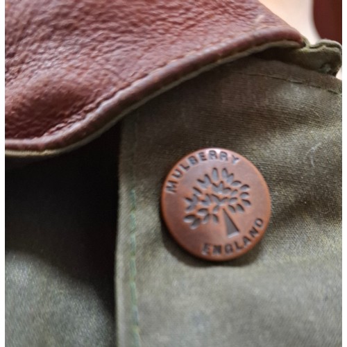 3 - Mulberry- A gents green wax cotton drovers coat having a brown leather collar and elbow pads and tar... 