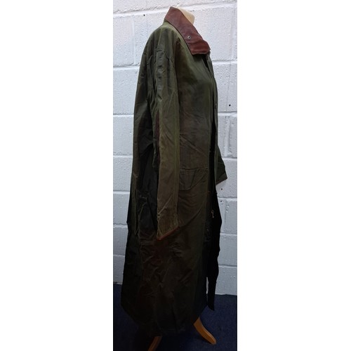 3 - Mulberry- A gents green wax cotton drovers coat having a brown leather collar and elbow pads and tar... 